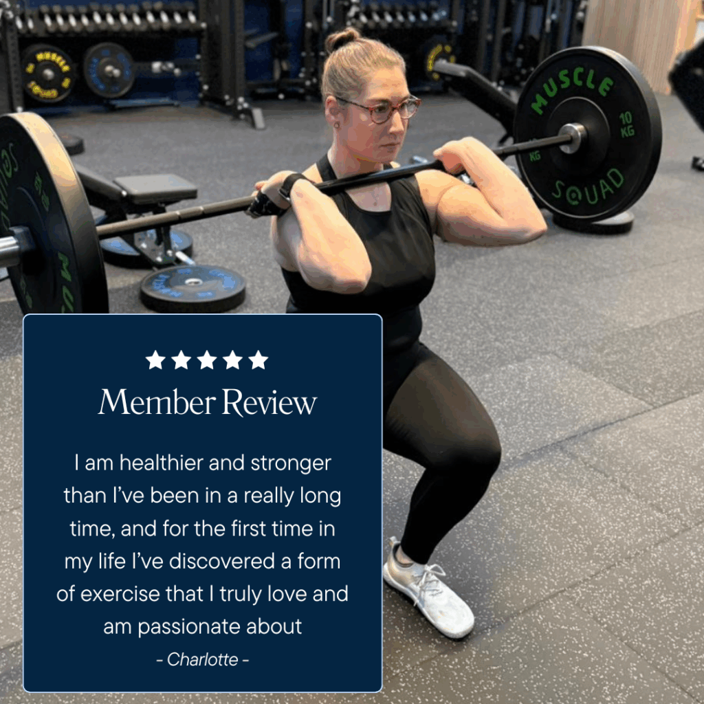 Woman in a gym doing a barbell lunge